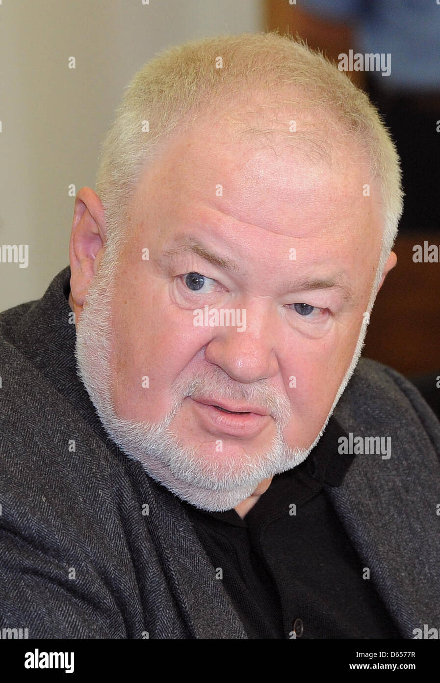 A court bailiff shows hotelier Axel Hilpert awaits the verdict in a A court bailiff shows hotelier Axel Hilpert awaits the verdict in a