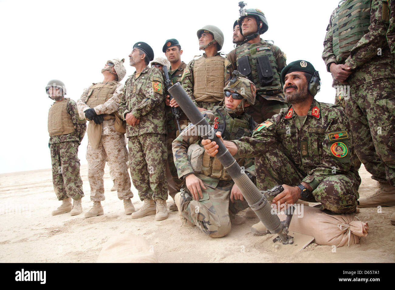 Afghan National Army Maj. Gen. Sayed Malook, the commanding general of the 215th Corps, fires a M224 mortar system during live fire training April 8, 201 at Camp Shorabak, Helmand province, Afghanistan. Stock Photo