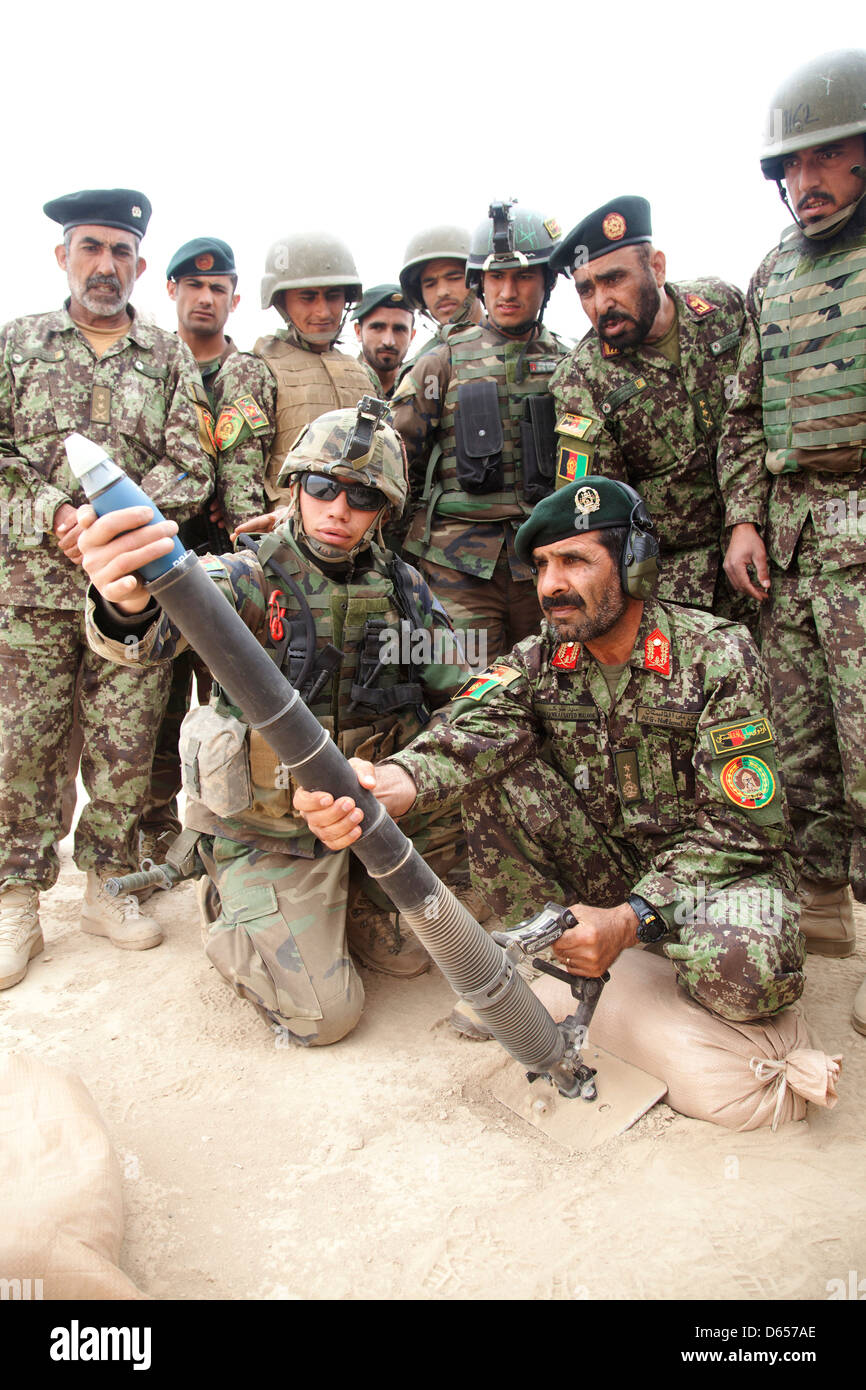 Afghan National Army Maj. Gen. Sayed Malook, the commanding general of the 215th Corps, prepares to fire a M224 mortar system during live fire training April 8, 201 at Camp Shorabak, Helmand province, Afghanistan. Stock Photo