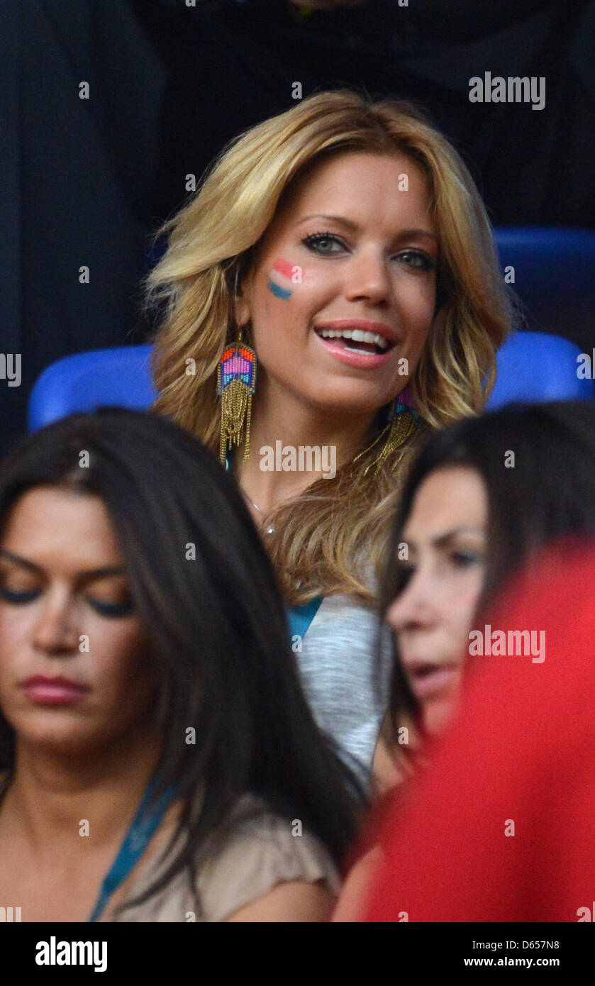 Sylvie van der Vaart, wife of dutch football player Rafael van der Vaart smiles in the stands prior to the UEFA EURO 2012 group B soccer match Netherlands vs Germany at Metalist Stadium in Kharkiv, the Ukraine, 13 June 2012. Photo: Thomas Eisenhuth dpa (Please refer to chapters 7 and 8 of http://dpaq.de/Ziovh for UEFA Euro 2012 Terms & Conditions)  +++(c) dpa - Bildfunk+++ Stock Photo