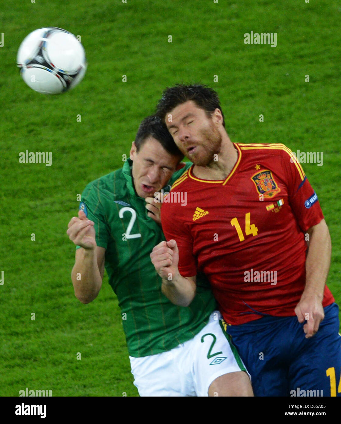 Spain's Xabi Alonso (R) and Ireland's Sean St Ledger vie for the ball during the UEFA EURO 2012 group C soccer match Spain vs Republic of Ireland at Arena Gdansk in Gdansk, Poland, 14 June 2012. Photo: Marcus Brandt dpa (Please refer to chapters 7 and 8 of http://dpaq.de/Ziovh for UEFA Euro 2012 Terms & Conditions)  +++(c) dpa - Bildfunk+++ Stock Photo