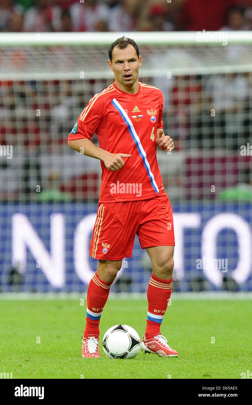 Russia's Sergei Ignashevich kicks the ball during the Euro 2012 match between Poland and Russia at the National Stadium in Warsaw, Poland, 12 June 2012. Photo: Revierfoto Stock Photo