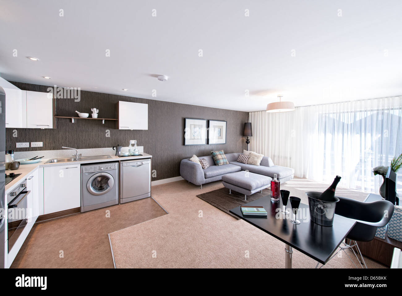 Champagne chilling in an ice bucket in a modern designer appartment Stock Photo