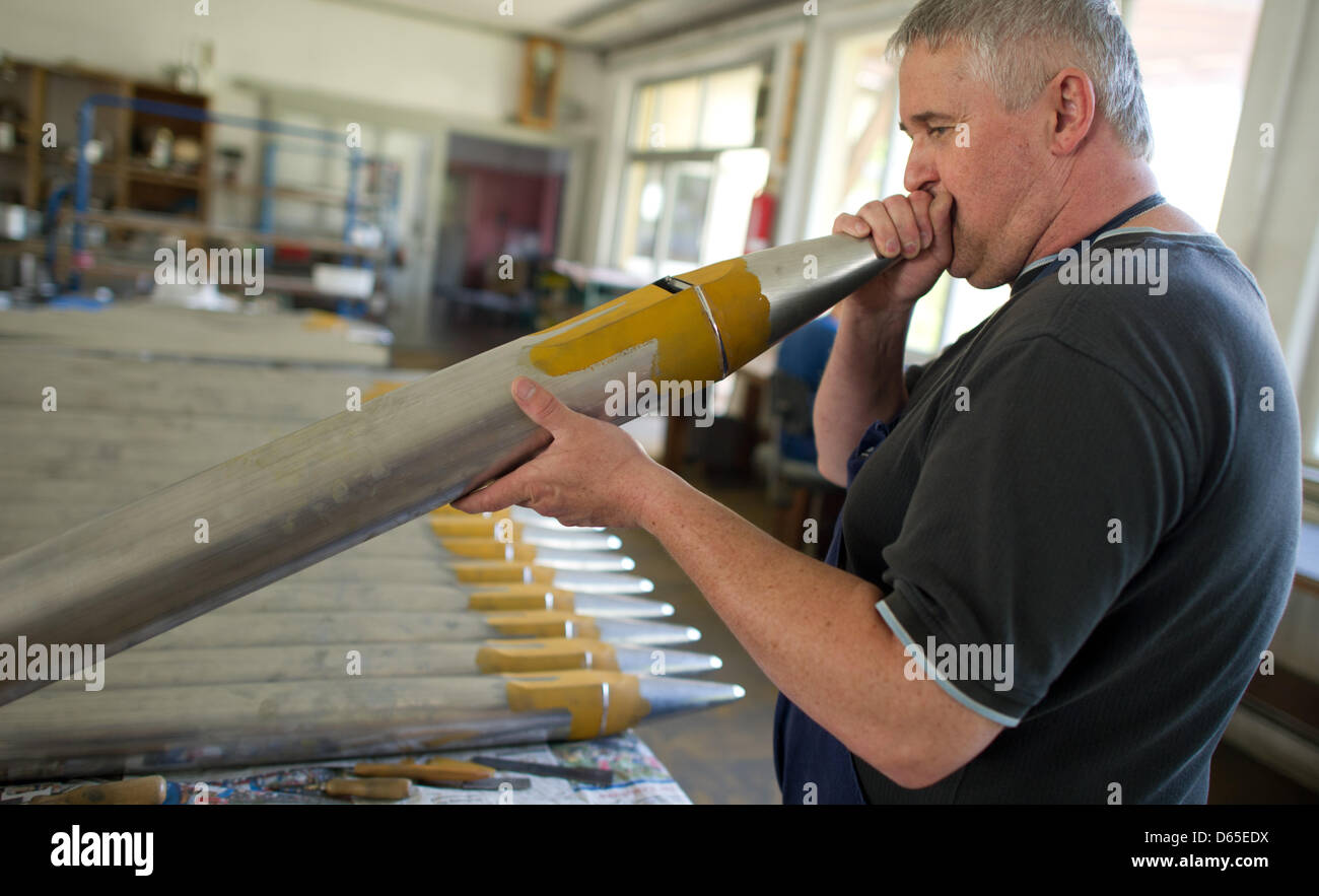An employee of organ pipe manufacturer Mittermaier & Soehne tries out an organ pipe Sinsheim, Germany, 24 May 2012. Photo: Uwe Anspach Stock Photo