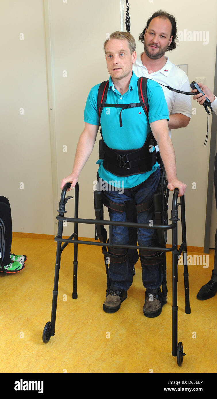 Physiotherapists have affixed walking robot EKSO on the legs of a