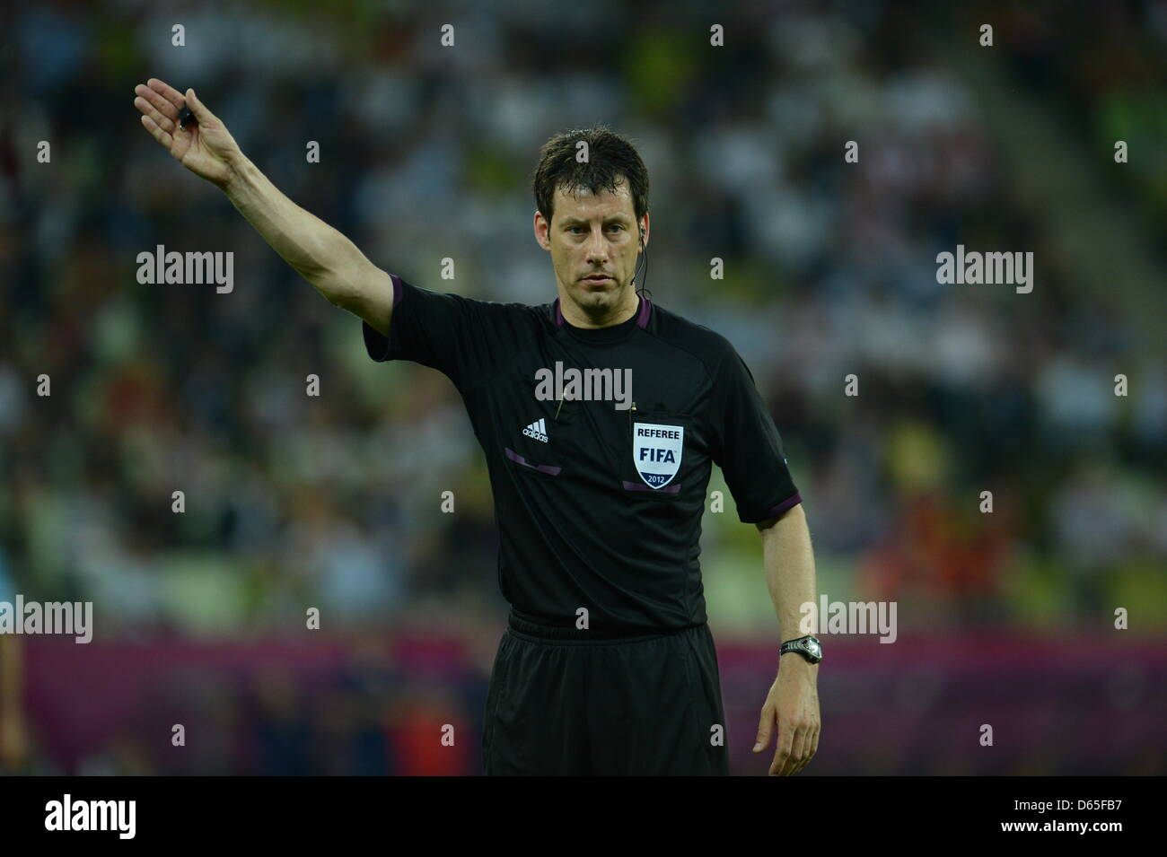 German referee Wolfgang Stark gestures during UEFA EURO 2012 group C ...