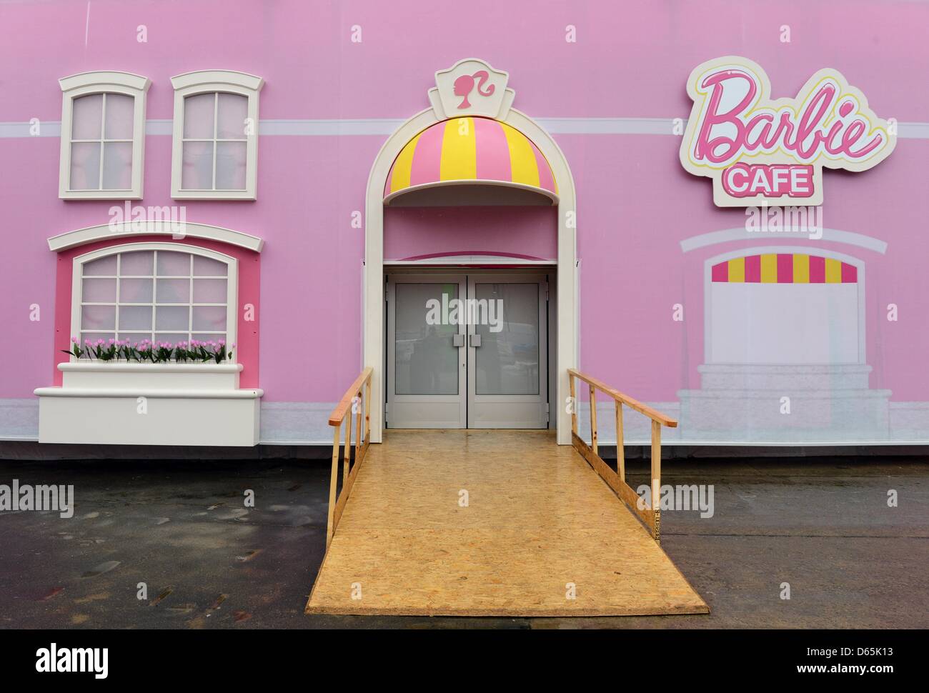 Barbie Cafe' is written next to the entrance to the'Barbie Dreamhouse'  exhibition near the Alexanderplatz in Berlin, Germany, 12 April 2013. The  temporary Barbie Dreamhouse exhibition covers an area of 2.500 square
