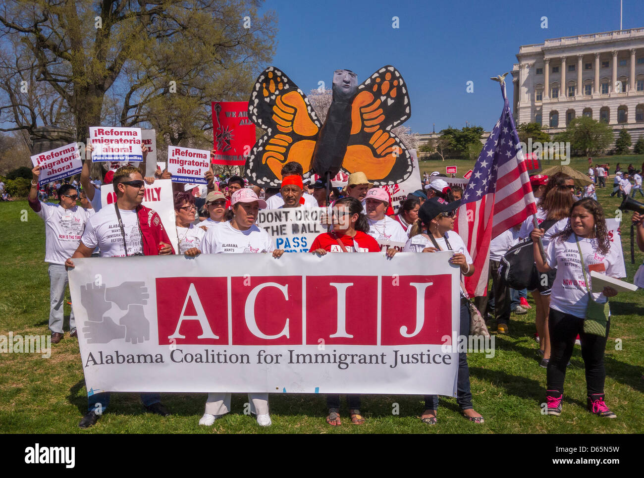 Washington DC, USA. 10th April 2013. Protesters from ACIJ hold sign during immigration reform rally at U.S. Capitol. Credit: Rob Crandall / Alamy Live News Stock Photo