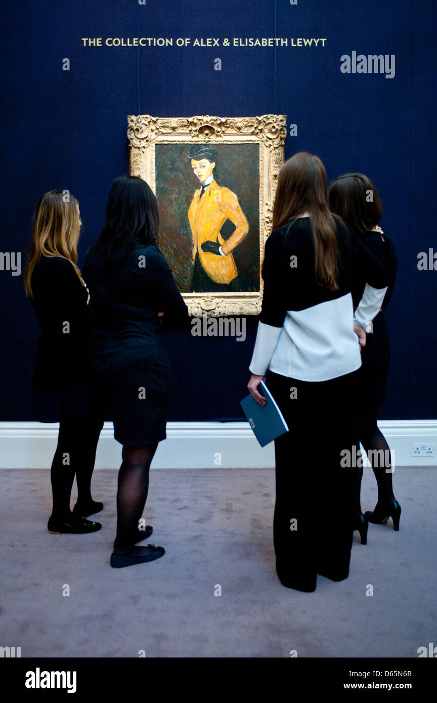 London, UK. 12th April 2013. Sotheby's employees pose in front of Amedeo Modigliani  'L'Amazone' (Est. $20-30 million). The work will go on sale at Sotheby’s New York in May 2013. The Blockbuster sales at include works by Richter, Modigliani, Picasso, Rodin, Bacon, Cezanne. Credit: Piero Cruciatti / Alamy Live News Stock Photo