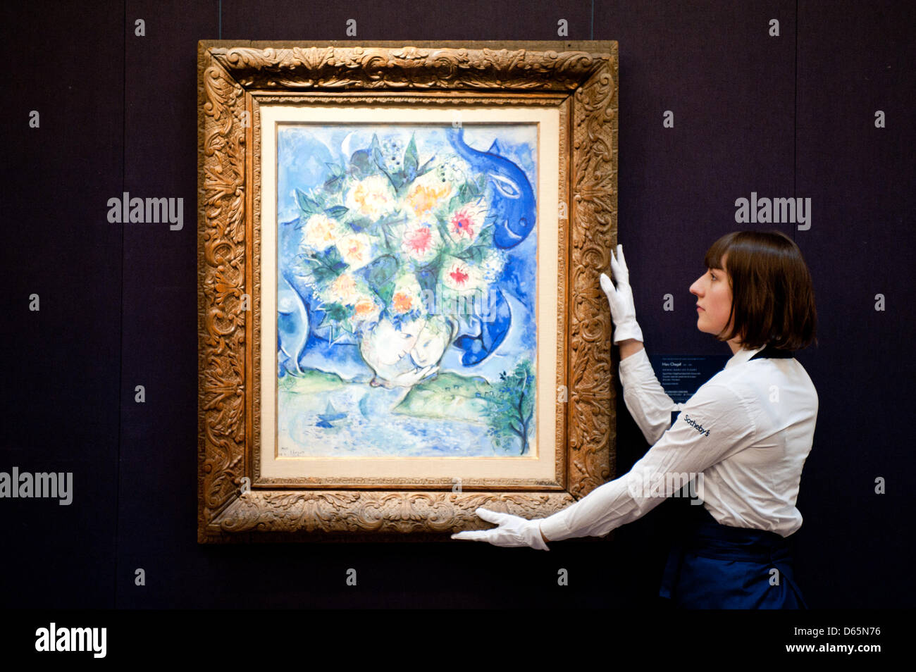 London, UK. 12th April 2013. A Sotheby's employee poses in front of  Marc chagall 'Pommes et Poires 1882-1885' (Est. $1-1,5 million). The work will go on sale at Sotheby’s New York in May 2013. The Blockbuster sales at include works by Richter, Modigliani, Picasso, Rodin, Bacon, Cezanne. Credit: Piero Cruciatti / Alamy Live News Stock Photo