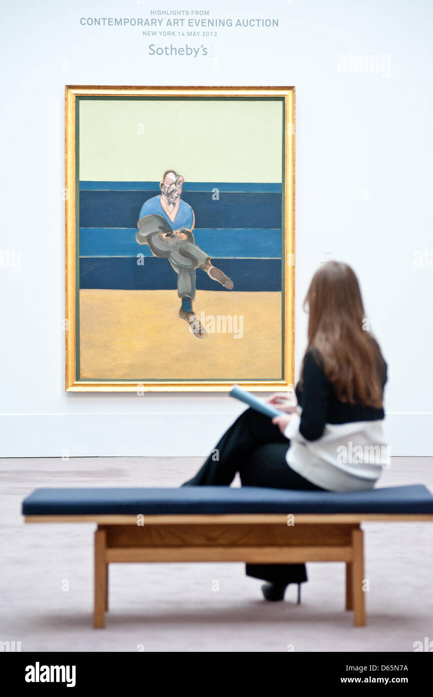 London, UK. 12th April 2013. A Sotheby's employee sits contemplating Francis Bacon's greatest painting of the love of his life, Peter Lacy (Est. $30-40 million). The work will go on sale at Sotheby’s New York in May 2013. The Blockbuster sales at include works by Richter, Modigliani, Picasso, Rodin, Bacon, Cezanne. Credit: Piero Cruciatti / Alamy Live News Stock Photo