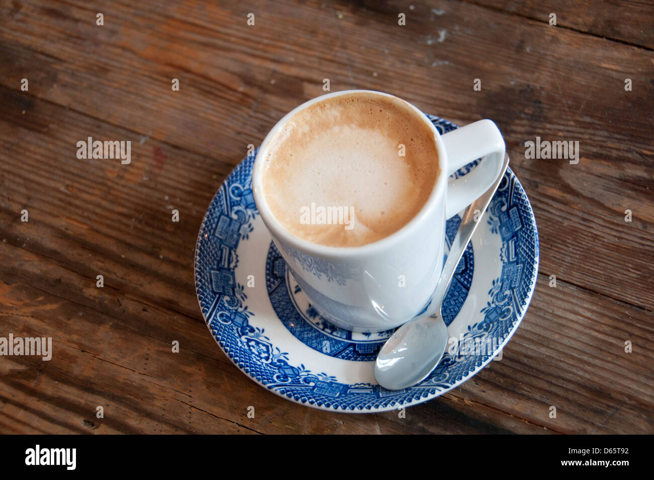 Hackney, London. Flat white coffee in willow pattern cup. Stock Photo