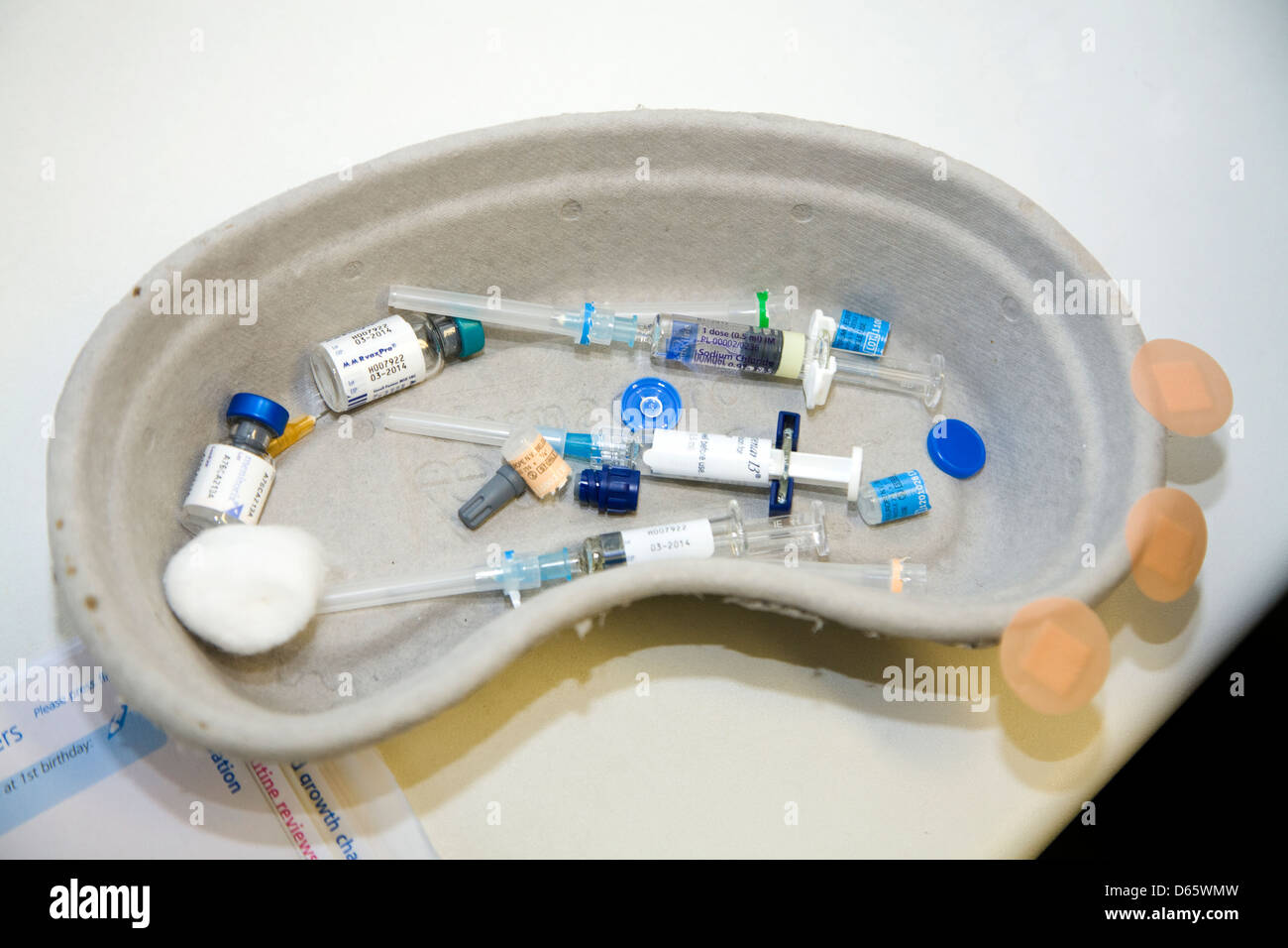 MMR immunisation / inoculation / jab / syringe / syringes & vaccine / vaccines against childhood disease / diseases in dish tray. Stock Photo