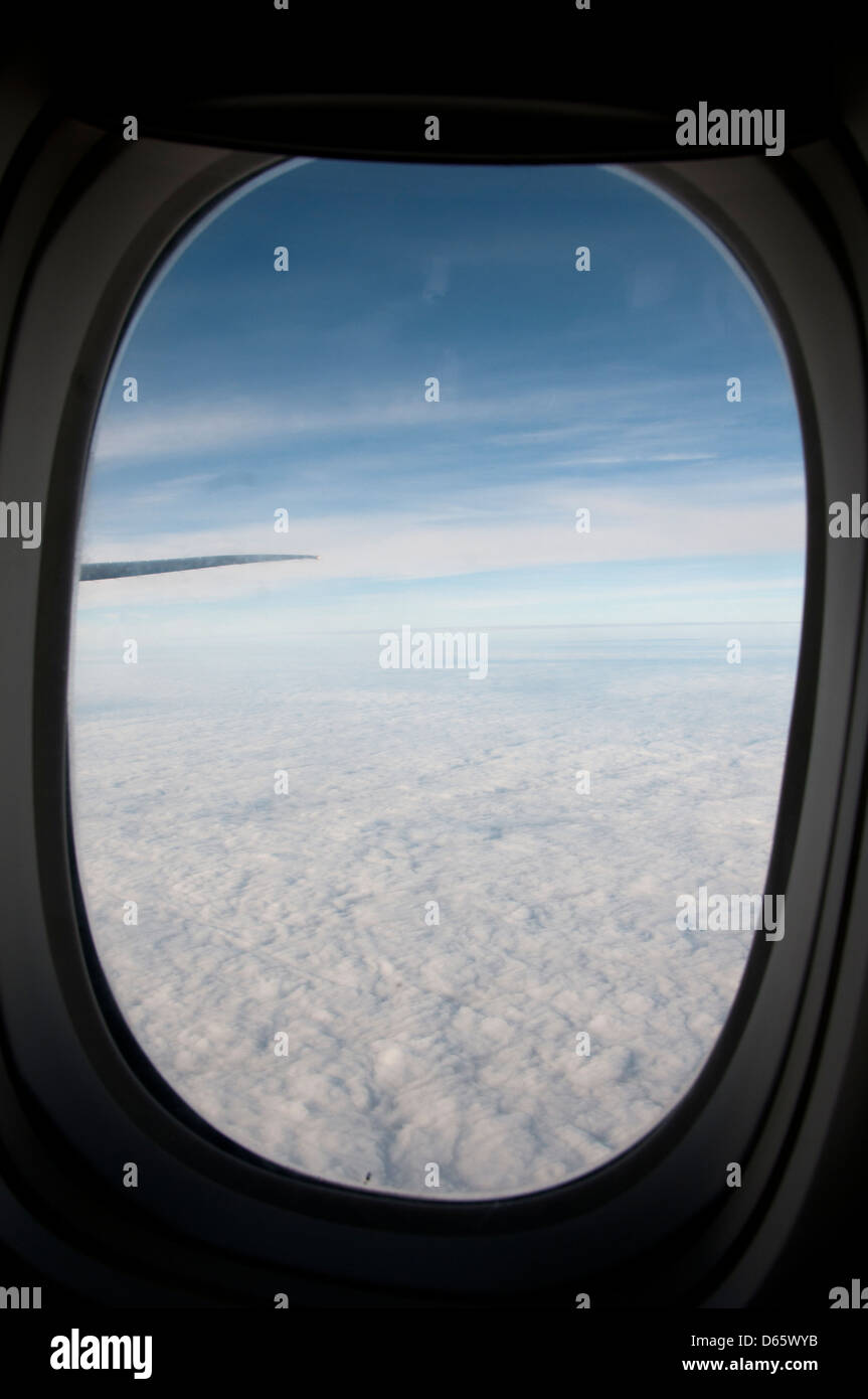 View of clouds from airline seat. Stock Photo