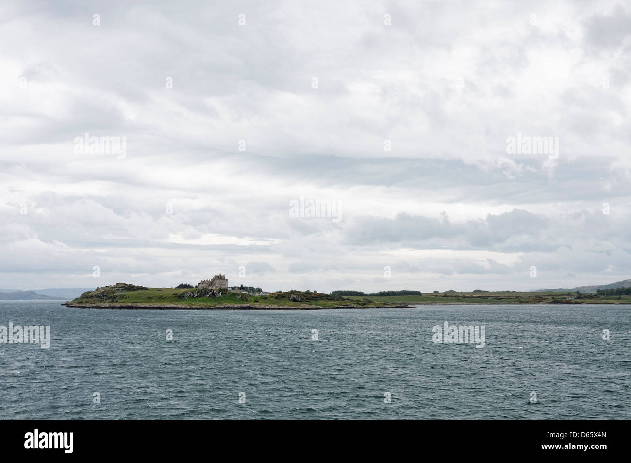 Duart Castle on the island of Mull, seen from a ferry from Oban to Craignure. Stock Photo