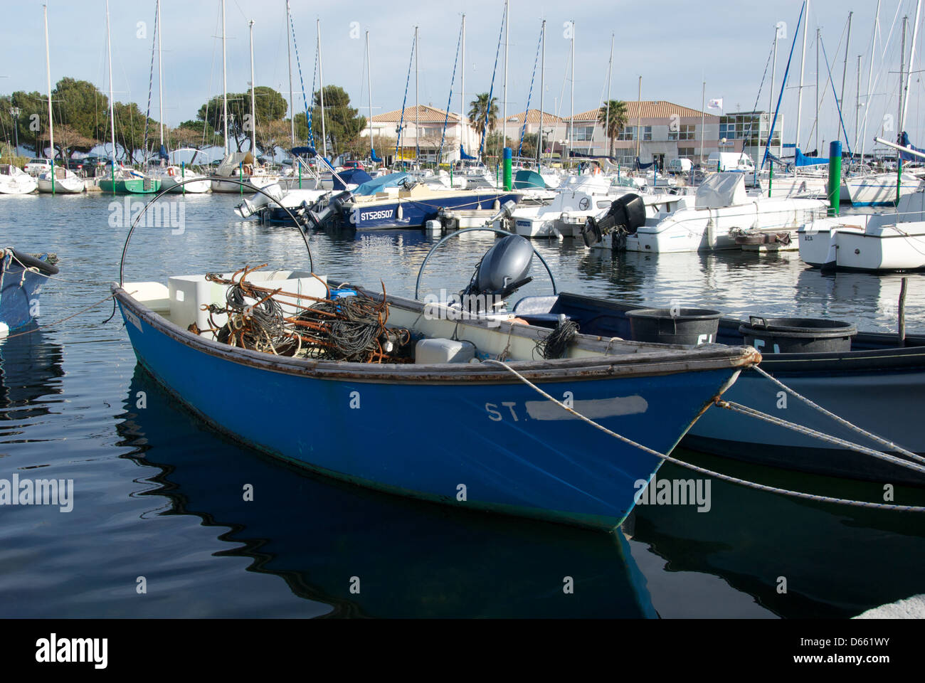 Small Blue Boat In Méze Harbor France Stock Photo