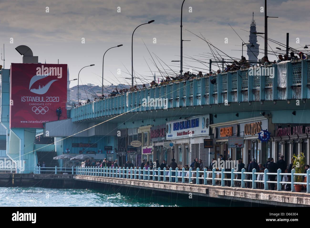 The Galata Bridge withTurkish men fishing in the Bosphorus, Istanbul Stock Photo
