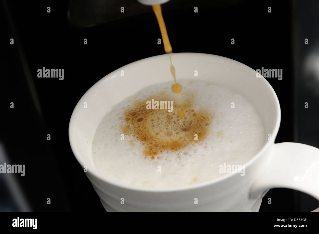 Tassimo coffee machine making cappuccino drink Stock Photo Alamy