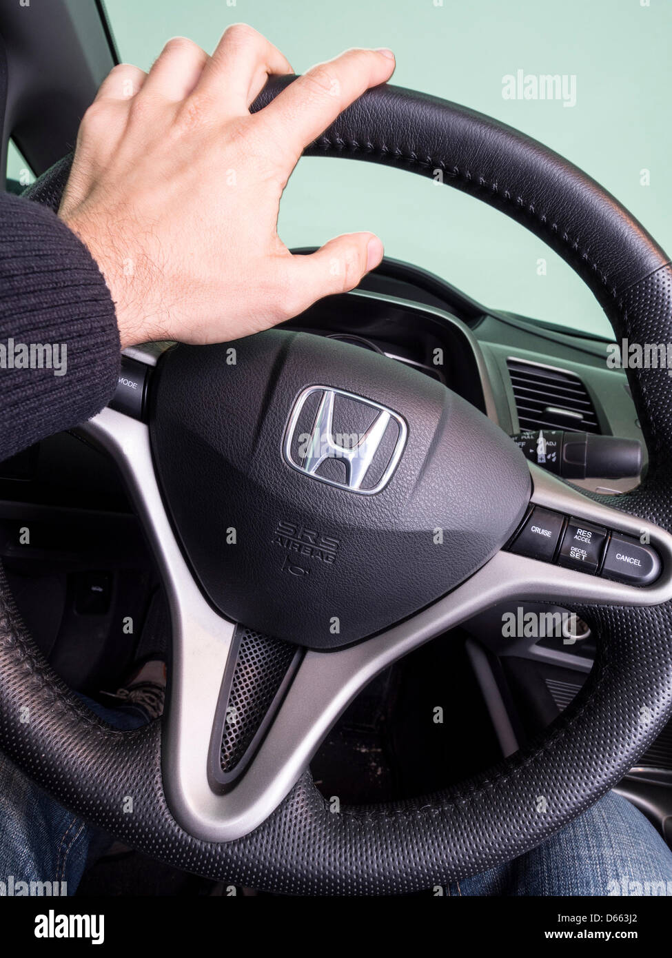 Hand On Honda Civic Hybrids Steering Wheel Stock Photo Alamy