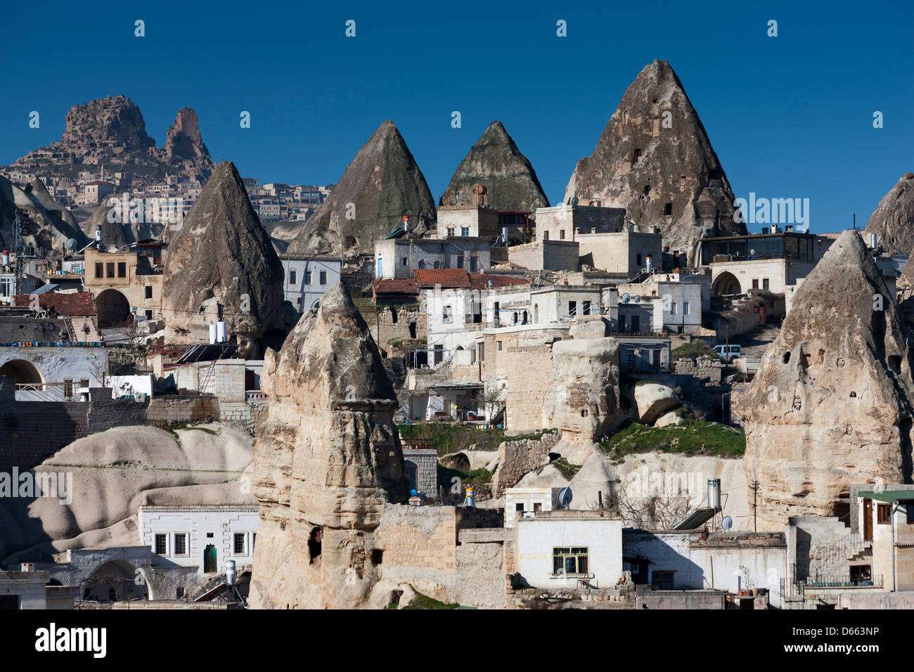 Rock formations known as fairy chimneys in the town of Göreme, Cappadocia, Turkey Stock Photo