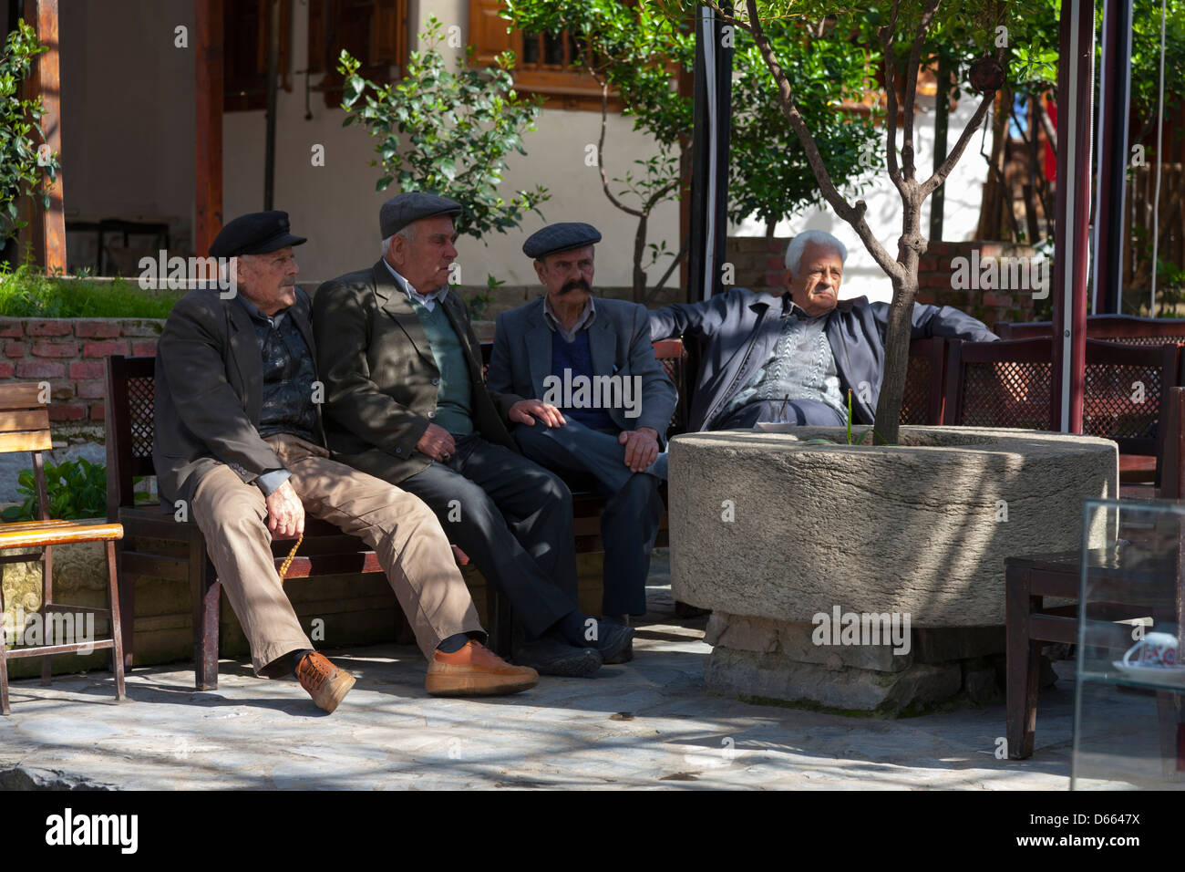 Turkish gentlemen outside a cafe in Sirince near Selçuk, Turkey Stock Photo