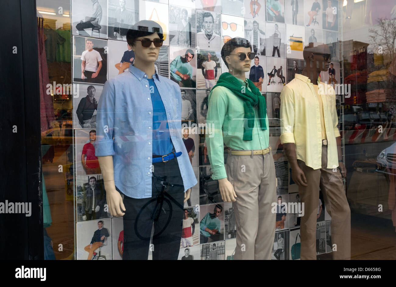 Three mannequins in the window of a men's fashion boutique on the Lower East Side in New York City Stock Photo