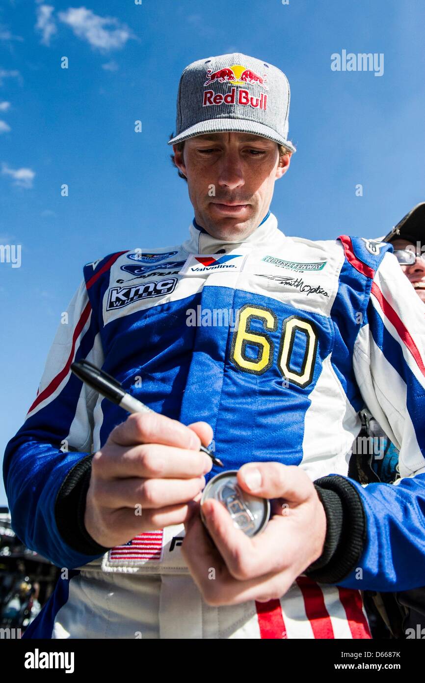Fort Worth, TX, U.S. APR 12, 2013. Travis Pastrana (60) signs a Red Bull can before practice for the O'REILLY AUTO PARTS 300 at the Texas Motor Speedway in Fort Worth, TX. Credit: Cal Sport Media  /Alamy Live News Stock Photo