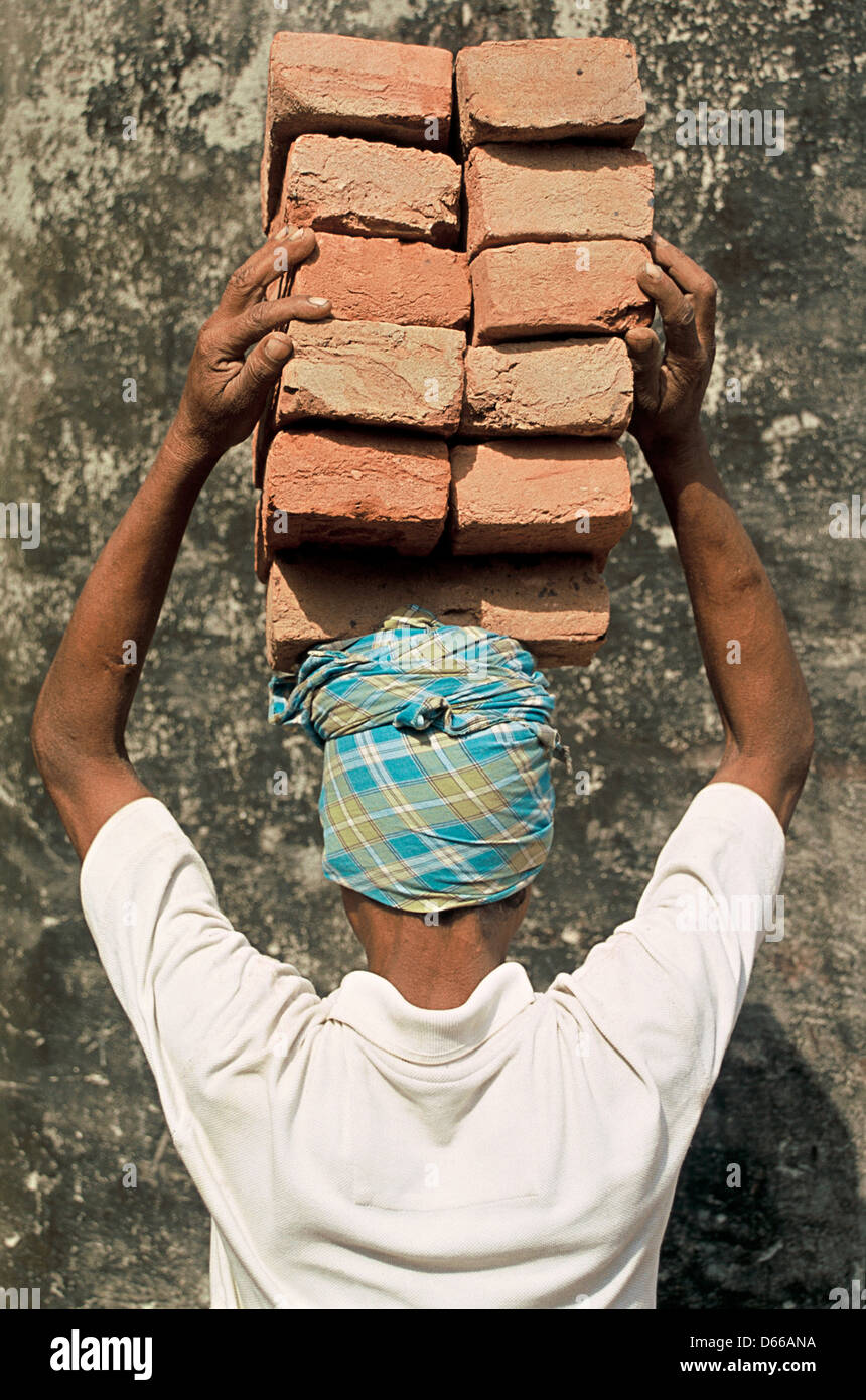 Mason carrying bricks on his head ( Nepal Stock Photo Alamy