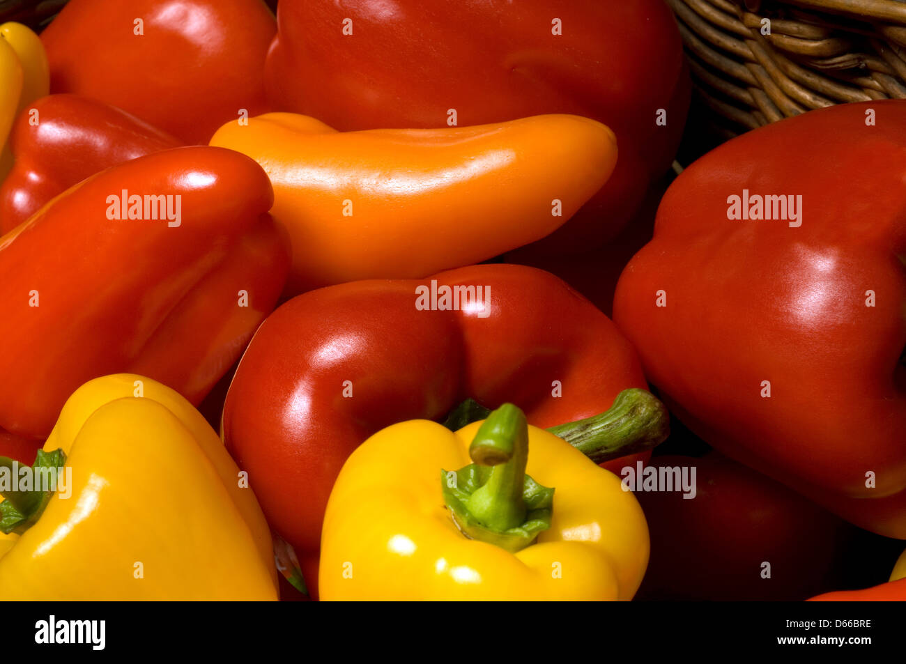 Mixed red, yellow and orange peppers Stock Photo