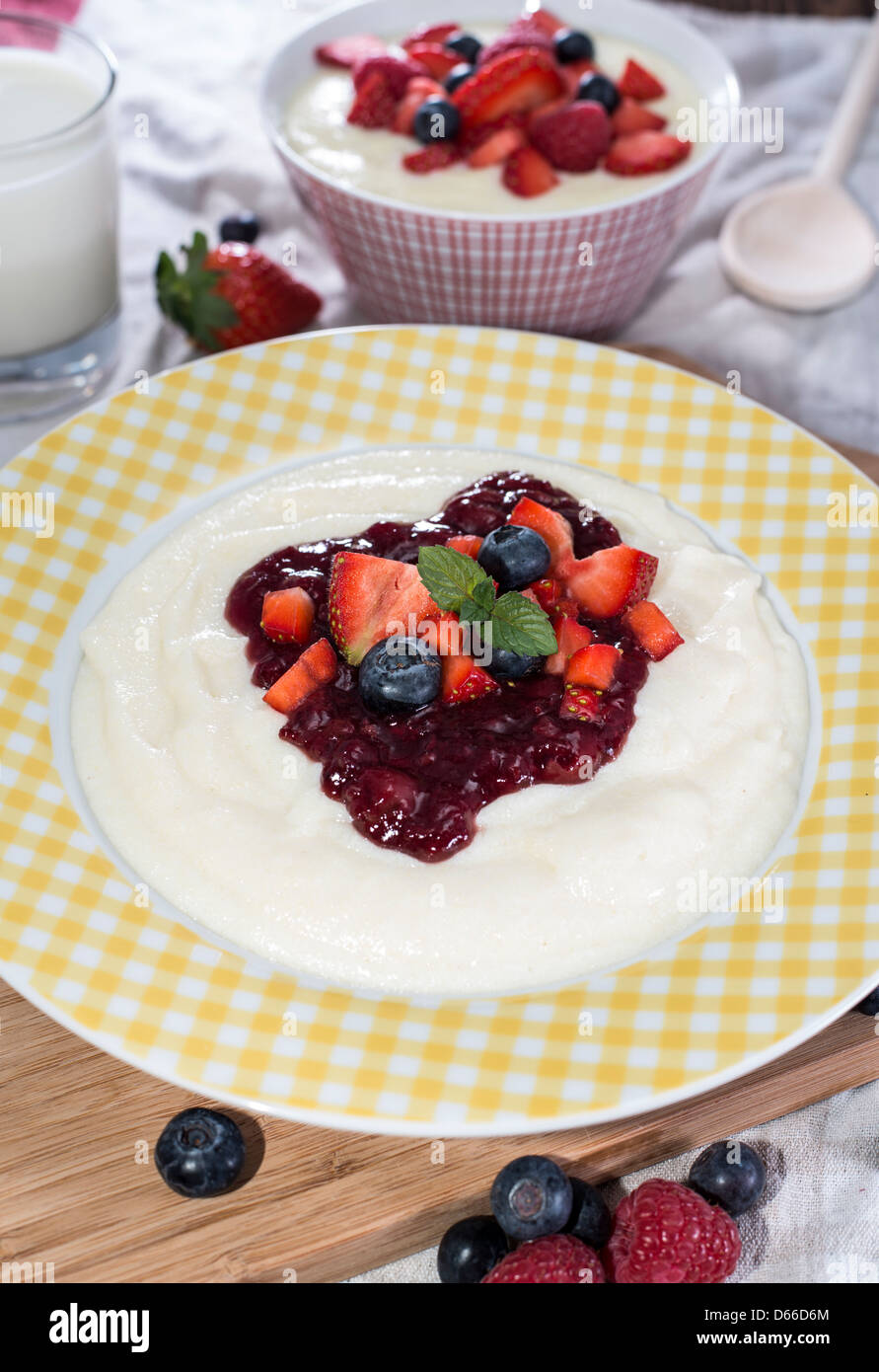 Semolina Pudding topped with fresh berries Stock Photo Alamy