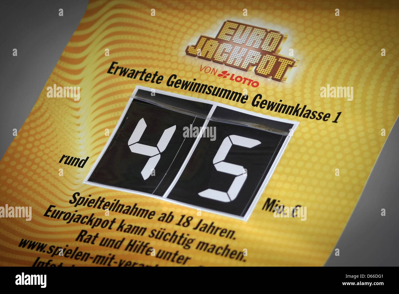 A banner displays the expected Euro Jackpot winning amount of 45 million  euros at a lottery business in Wiesbaden, Germany, 13 April 2013. The  winning numbers were drawn in Helsinki on 12