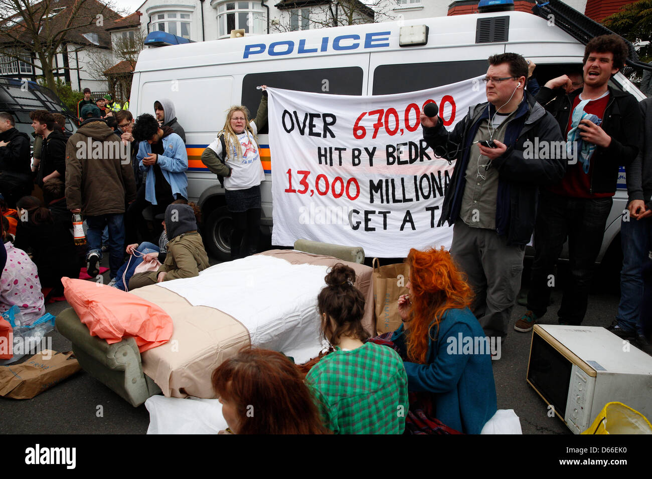 London, UK. 13th April 2013. The 'Who wants to evict a millionaire?' event held by UK Uncut were using civil disobedience in London protesting against a massive wave of cuts that will hit millions of people across the country. Protesters were gathered outside Lord Freud's house with mattresses, blankets and placards. Credit: Lydia Pagoni /Alamy Live News Stock Photo