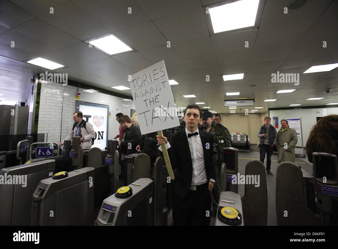 London, UK. 13th April 2013.  Protester leaves Archway underground station on the way to protest at the London home of Lord Freud, Welfare Minister and a key proponent of the 'bedroom tax'.Credit: Rob Pinney/Alamy Live News Stock Photo