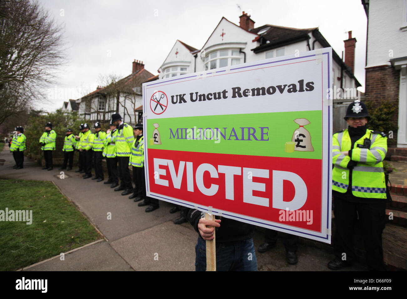 London, UK. 13th April 2013.  Activist erects an eviction notice outside the London home of Lord Freud, Welfare Minister and a key proponent of the 'bedroom tax'.Credit: Rob Pinney/Alamy Live News Stock Photo