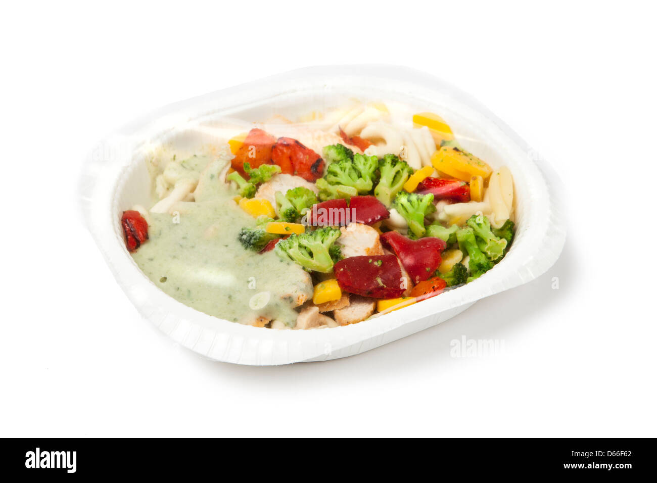 paper plate with prepackaged fast food with plastic foil on top. Stock Photo