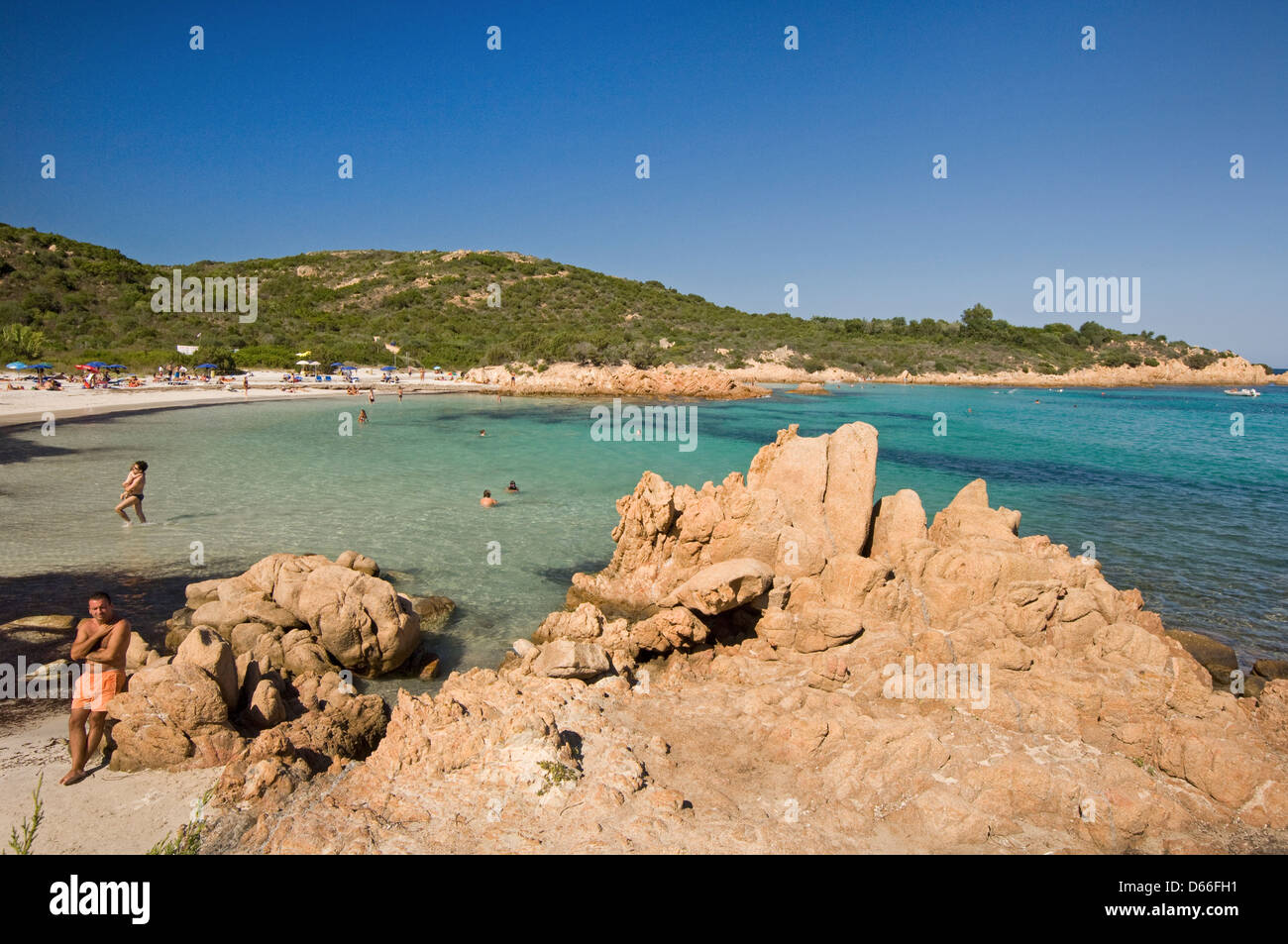 The Principe beach with tourists and granite rocks near Porto Cervo, Arzachena, Costa Smeralda, Emerald coast,Sardinia, Italy Stock Photo