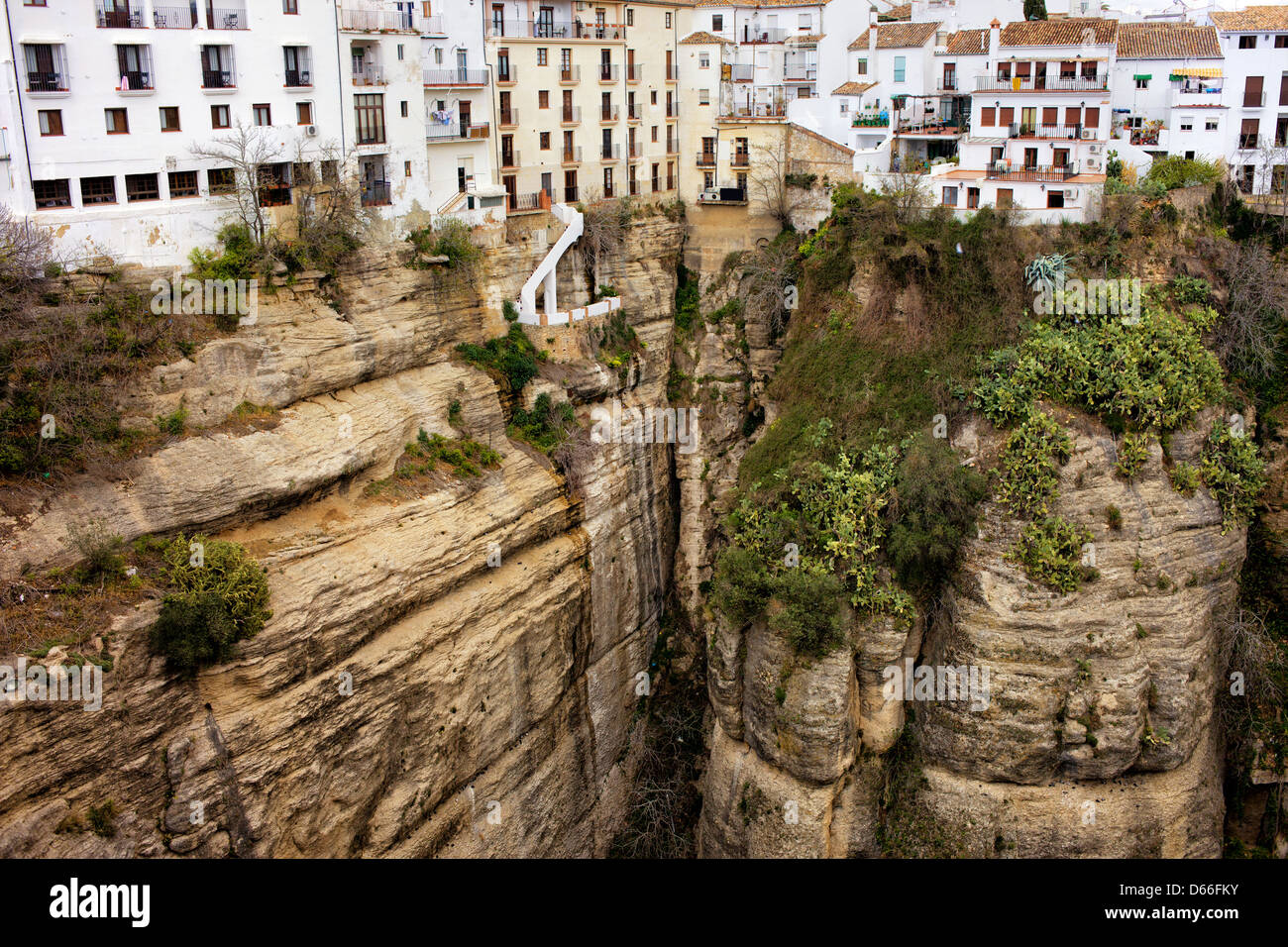 Traditional houses on a high cliffs of El Tajo Gorge in Ronda town ...