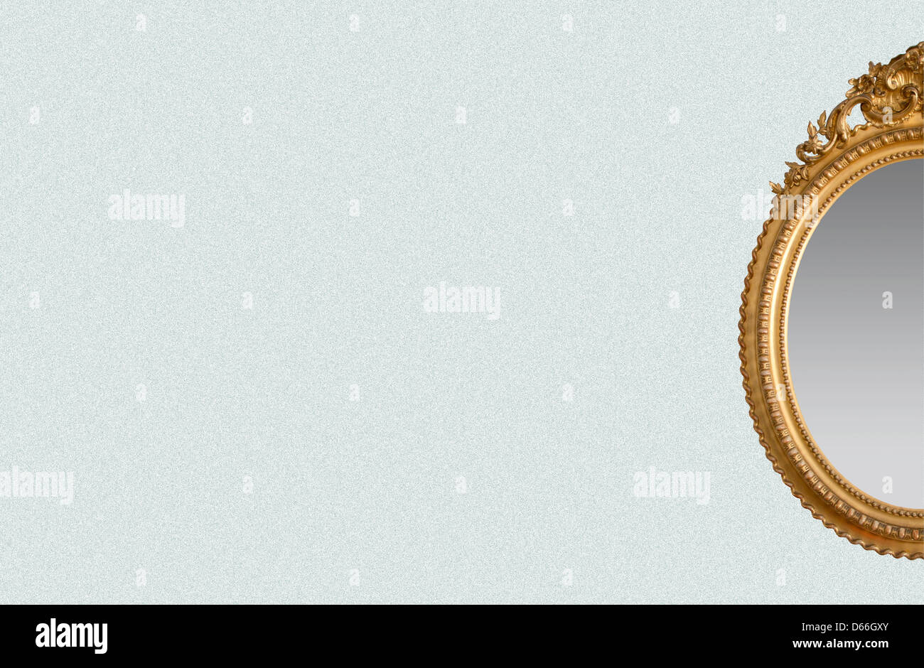 An ornate golden mirror on a white background. Stock Photo