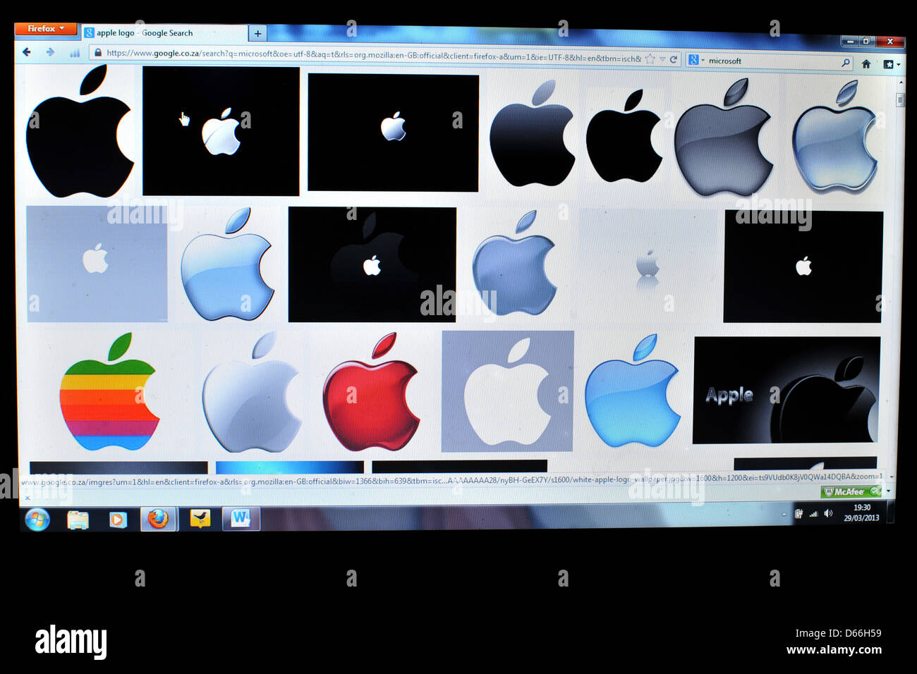 Image of a laptop screen showing the results of a Google image search for the Apple computer company. Stock Photo