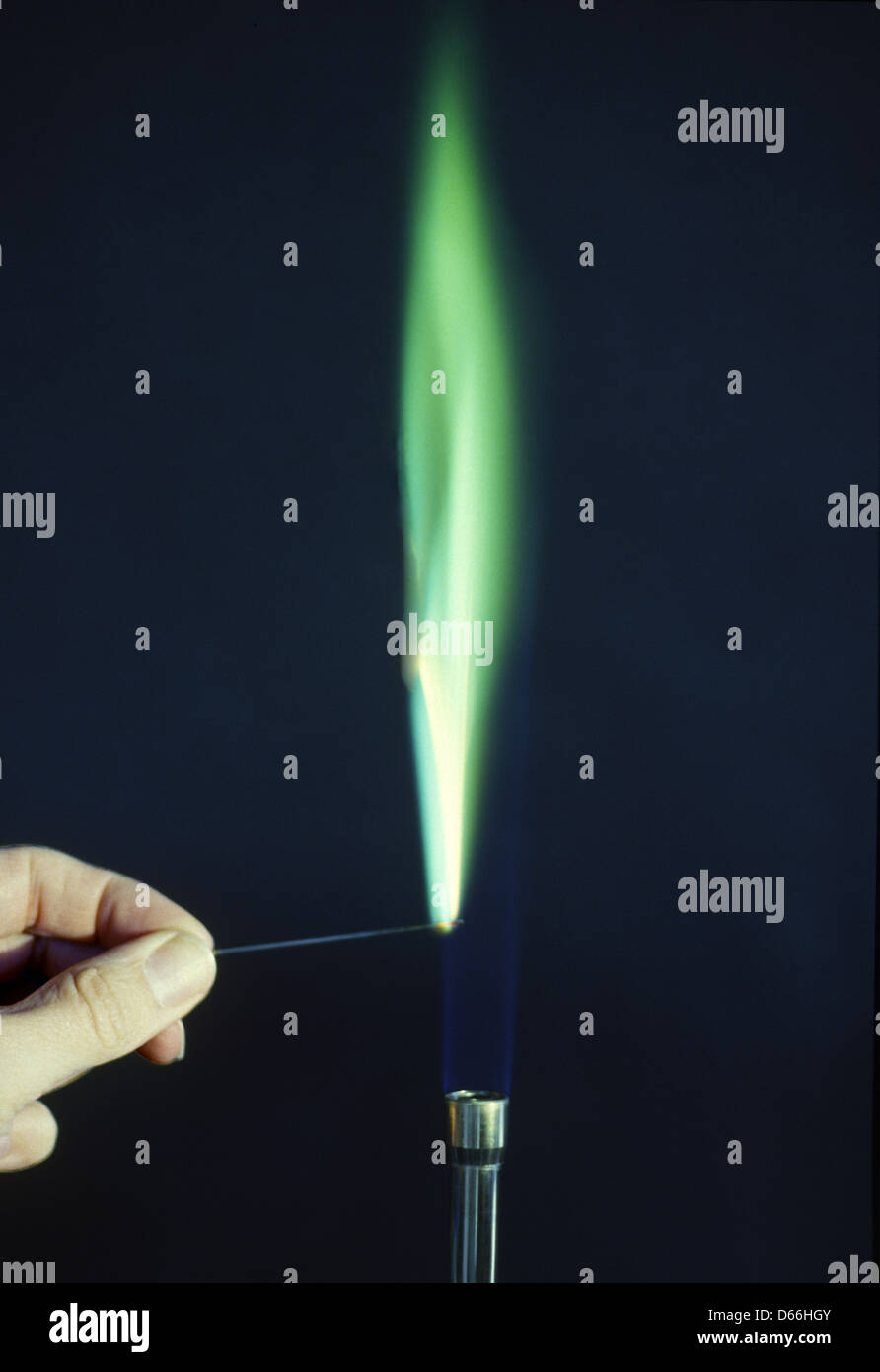A flame test for copper. Copper's compounds produce a blue-green coloured flame when burnt. Stock Photo