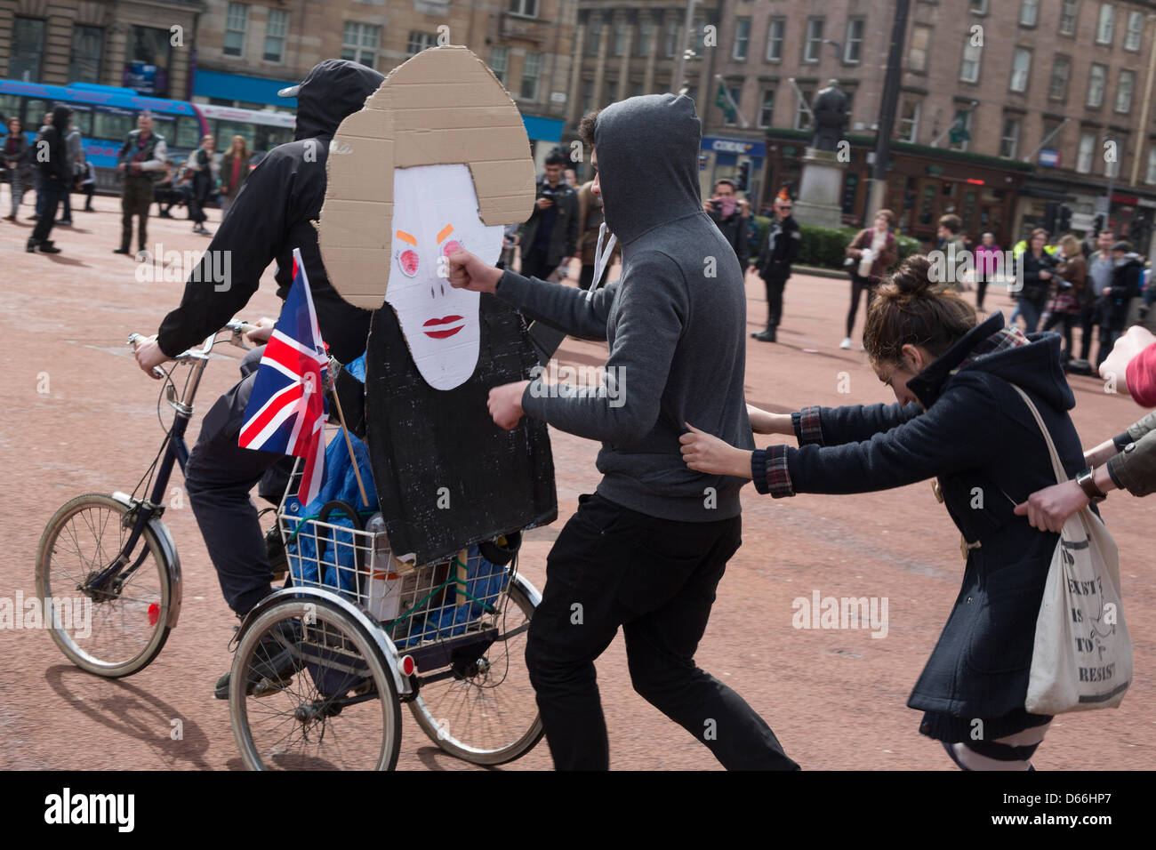 George Square, Glasgow, Scotland, UK. Saturday 13th April 2013. 'Thatcher is Dead' party, with an attempt to burn an effigy of British Conservative politician Baroness Margaret Thatcher, by young people, in George Square. Credit: Jeremy Sutton-hibbert /Alamy Live News Stock Photo