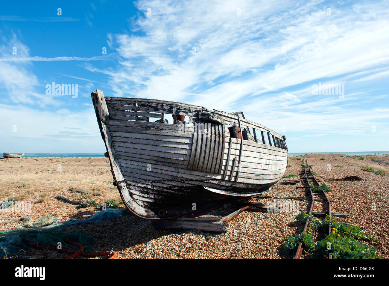 Disused fishing boat on the beach at Dungeness, Kent, UK Stock Photo