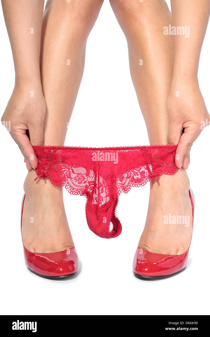 Woman legs taking off red underwear Stock Photo - Alamy