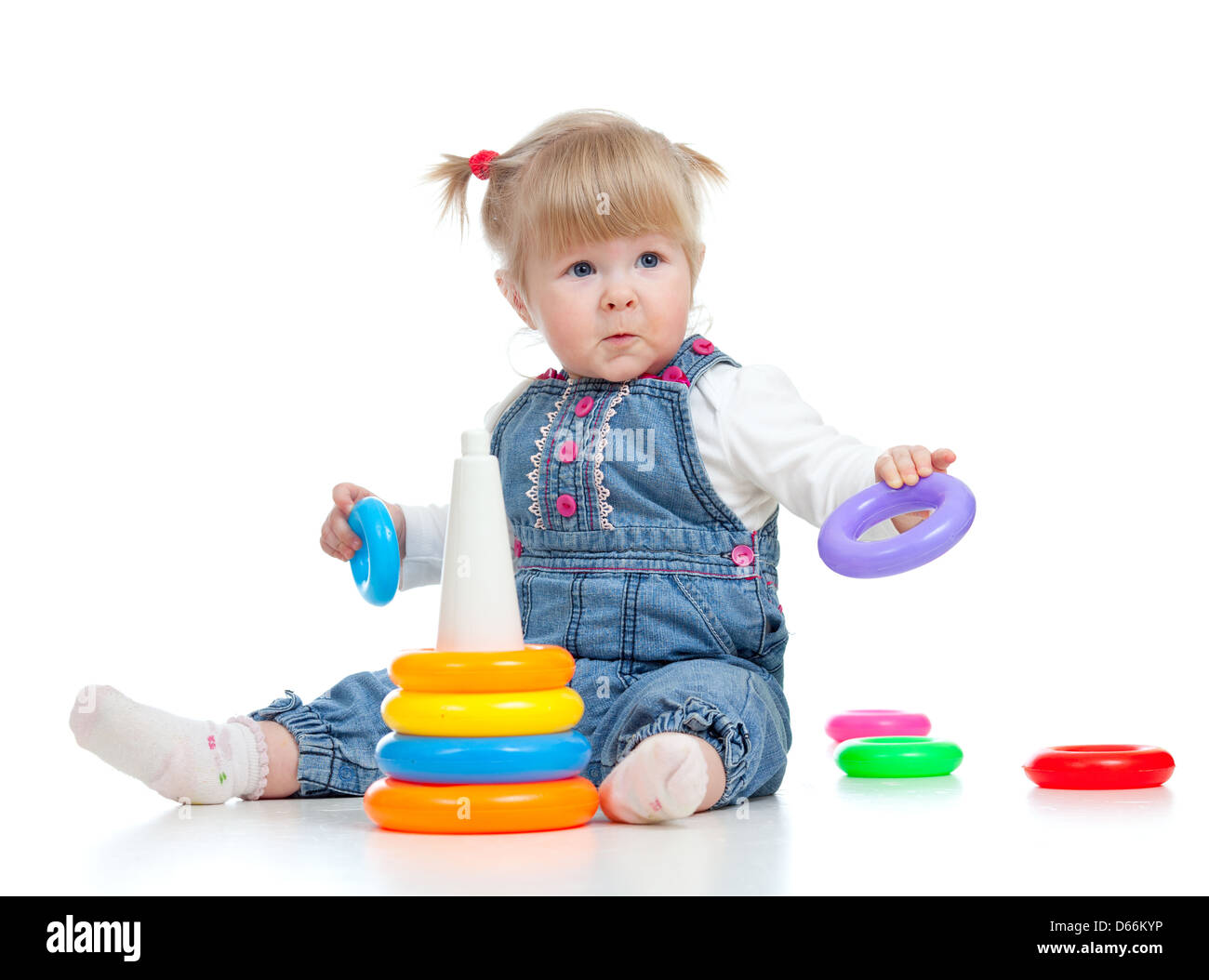 child playing with color pyramidion Stock Photo - Alamy