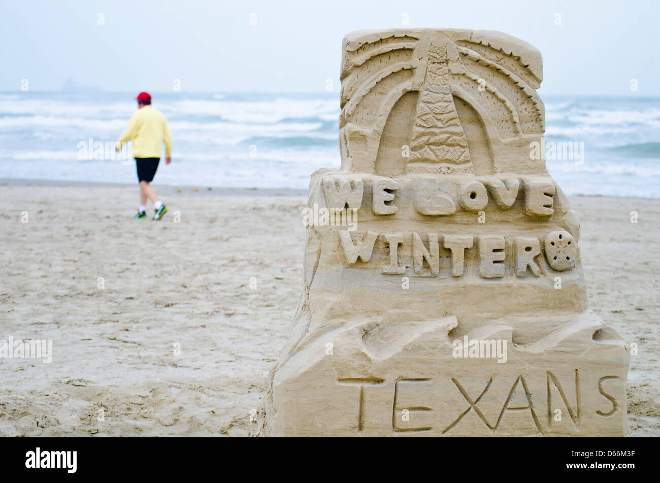 Sand sculpture on the Gulf coast beach in Port Aransas, Texas says 'We Love Winter Texans' Stock Photo