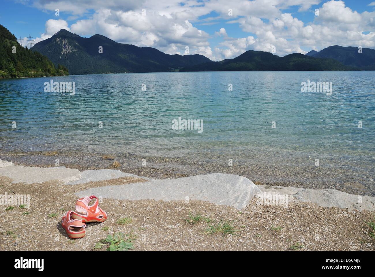 Pair of shoes at Lake Walchensee in the bavarian alps. Stock Photo