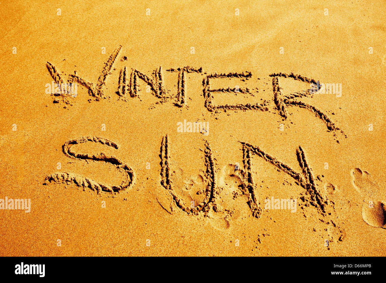 Messages and words written in the sand on a beach. Topical for travel