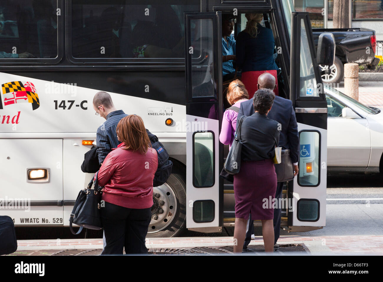 People boarding a bus - USA Stock Photo