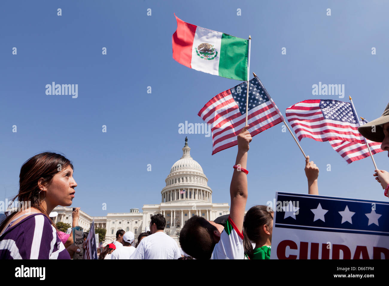 Young boy waving a Mexican flag in front of the US Capitol building during an immigration reform rally - Washington, DC USA Stock Photo