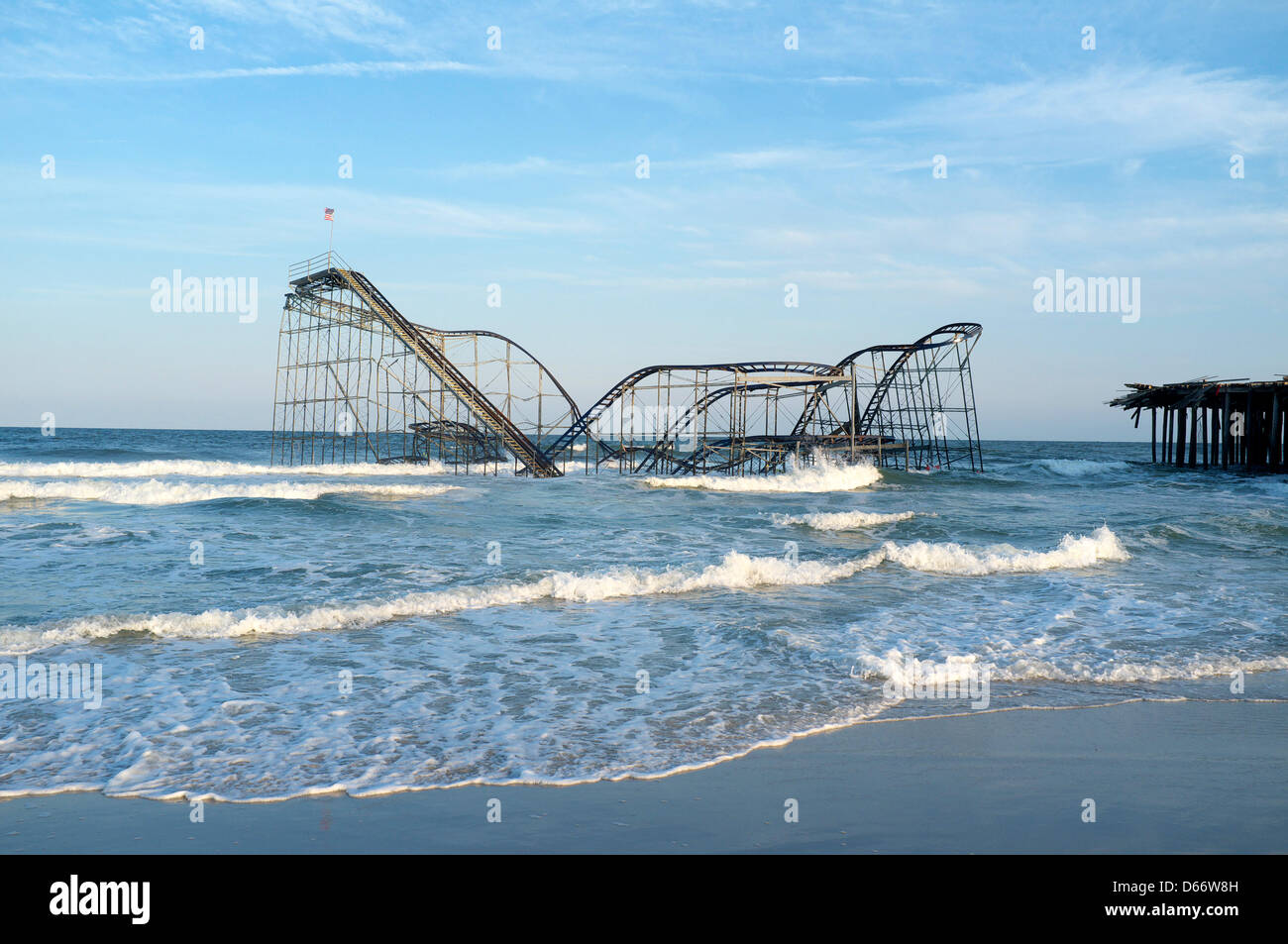 The Jet Star roller coaster still sets in the Atlantic Ocean in Seaside Heights, NJ USA.  The roller coaster was deposited there by Hurricane Sandy in October 2012 and was removed in May of 2013 Stock Photo